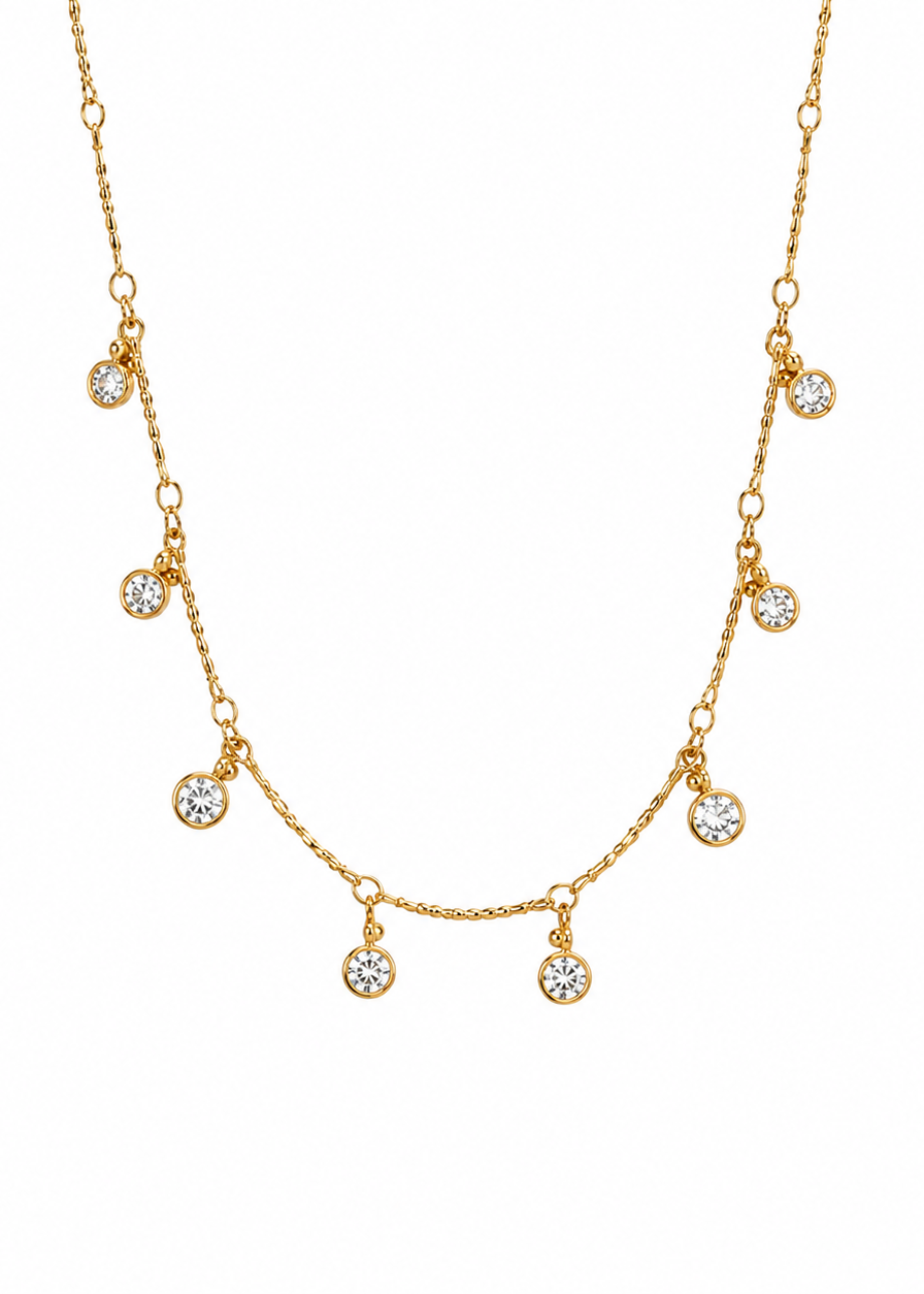 A delicate gold chain necklace featuring seven small, round bezel-set clear crystals arranged in a gentle arch on a plain white background.