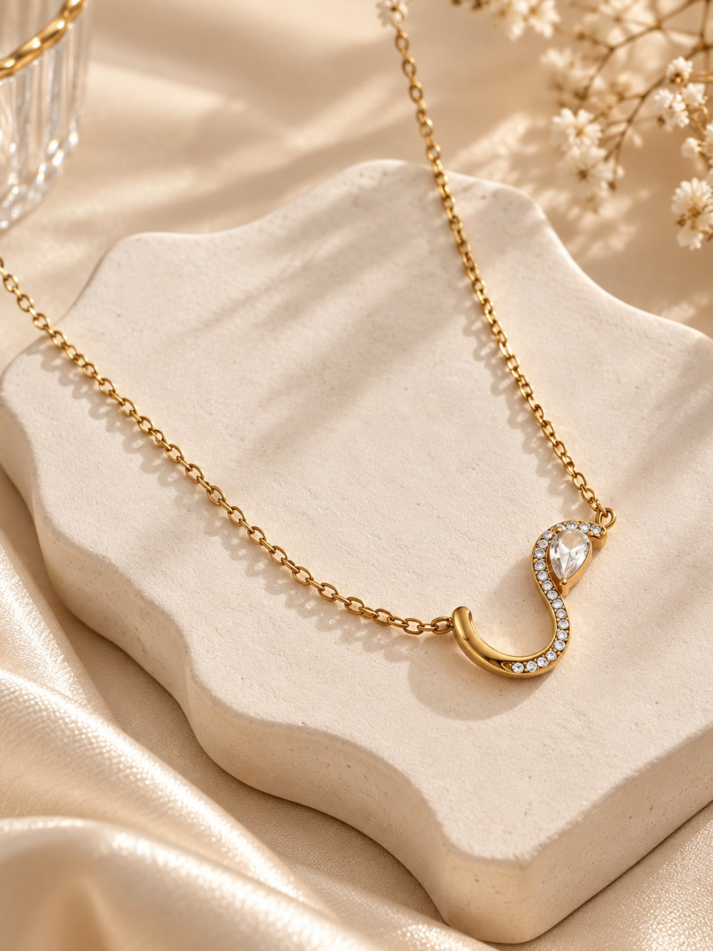 Serpentine S Necklace – flat lay – Pabeena