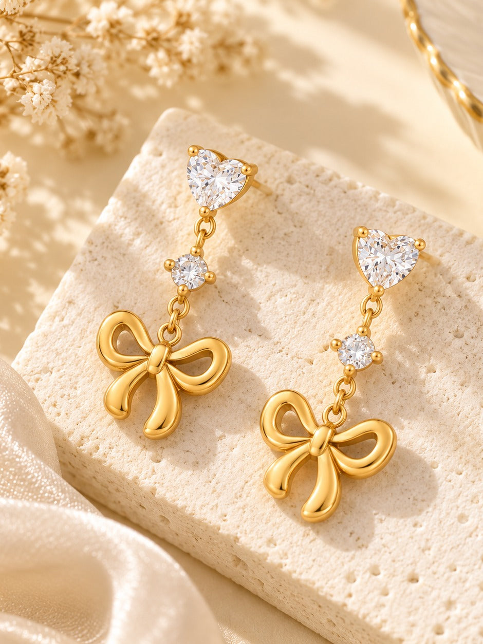 Bowtie Heart Drop Earrings – flat lay – Pabeena