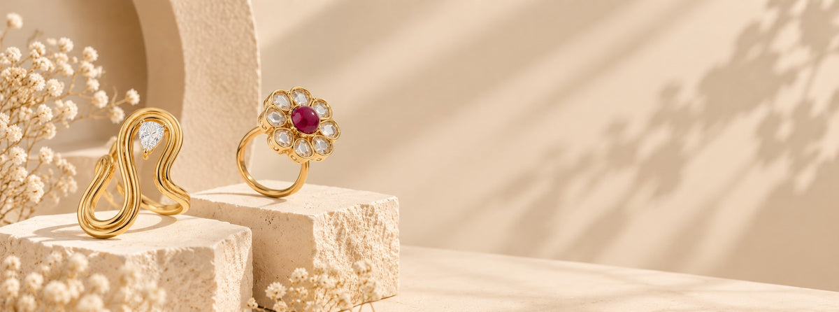 Pabeena gold-plated wave ring with a pear stone and a ruby-and-kundan flower ring
